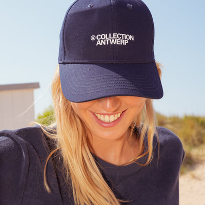 X cap X collection Antwerp logo